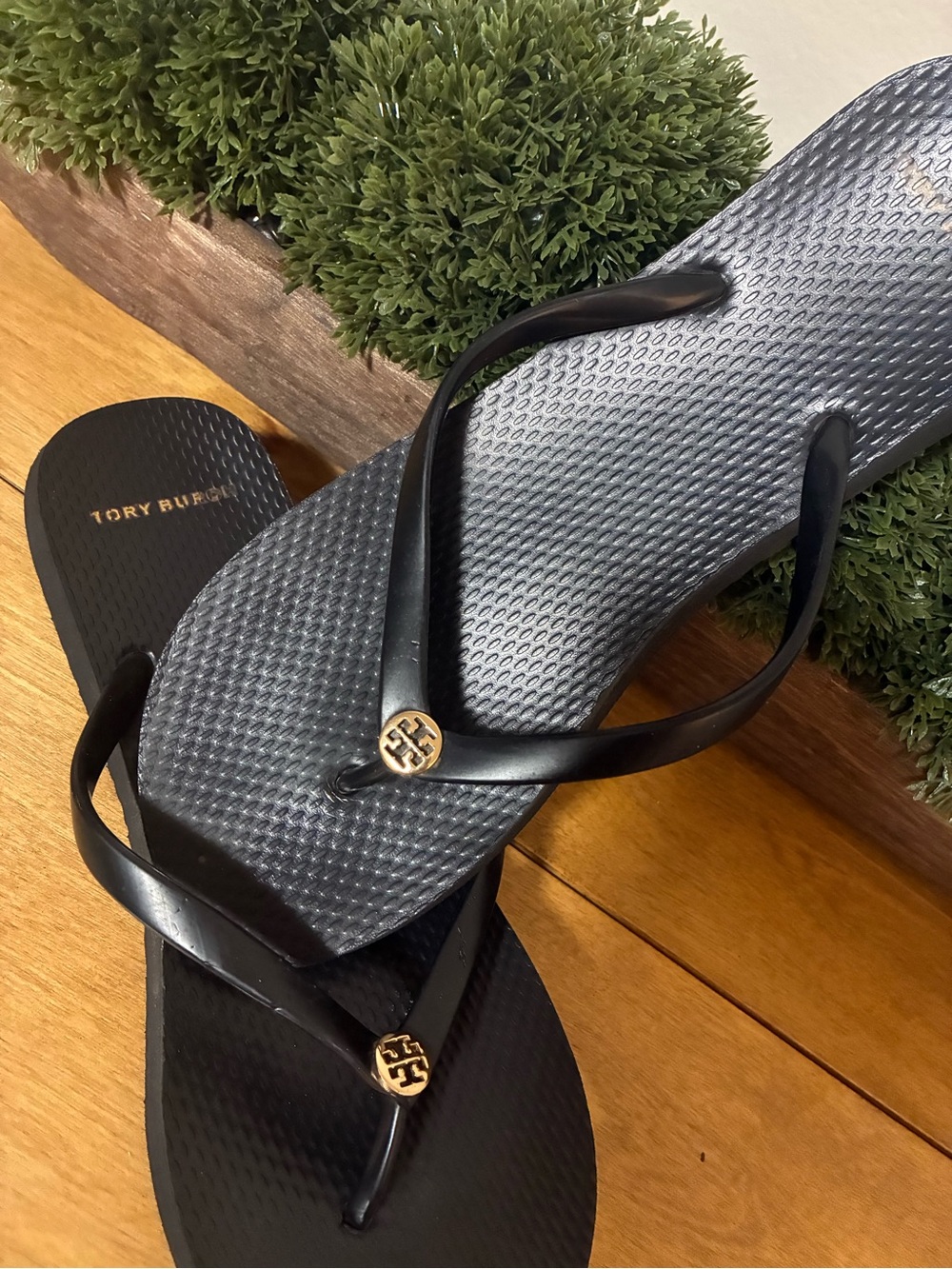 Tory Burch Black Flip Flop Sandals with Gold Logo Accent
